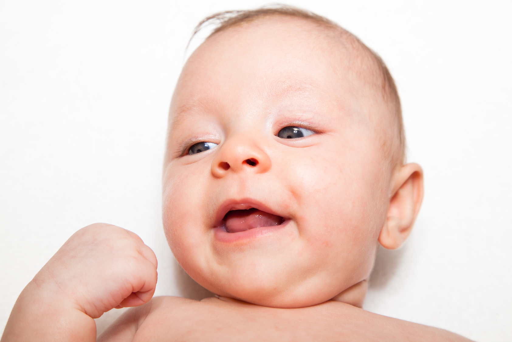 Happy baby head and shoulders on white background