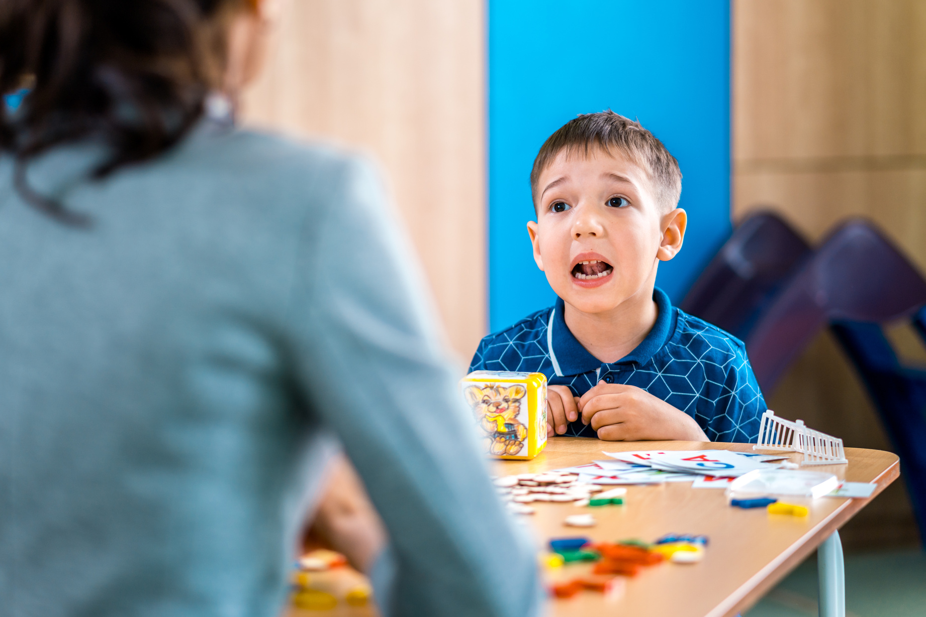 Boy Is Doing Exercise to Correctly Articulation During Speech Therapy Session